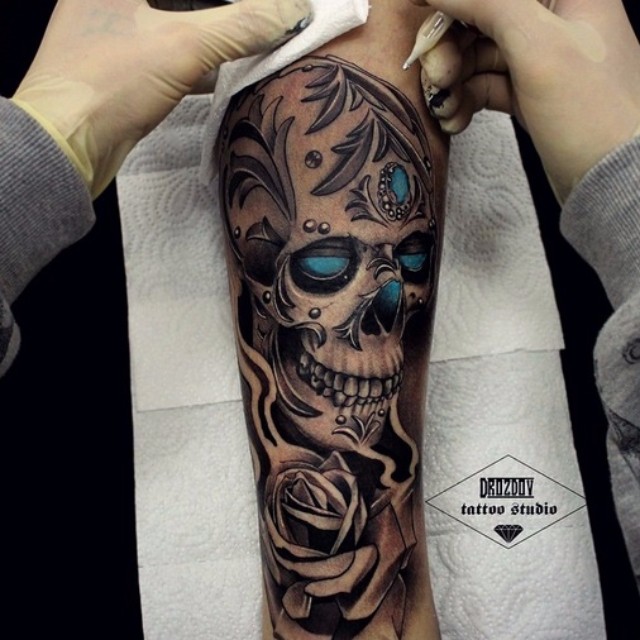 Elegant Gems Inlaid Skull tattoo by Vladimir Drozdov
